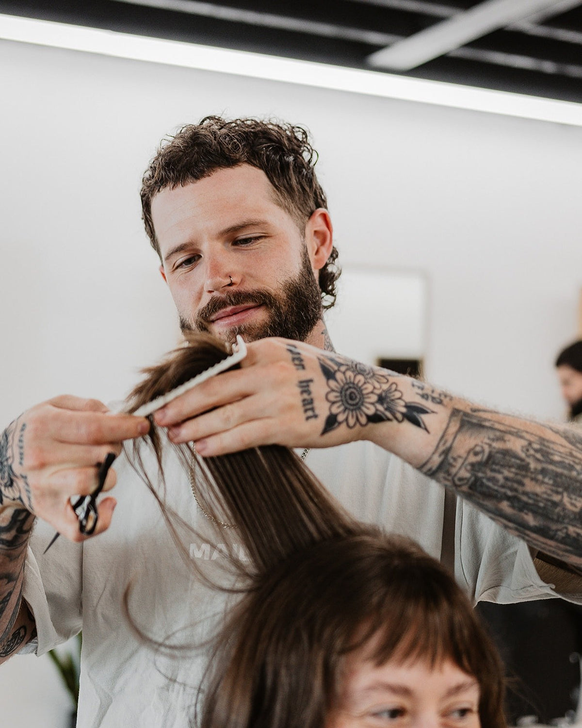 a mailroom barber at work in the greenville shop
